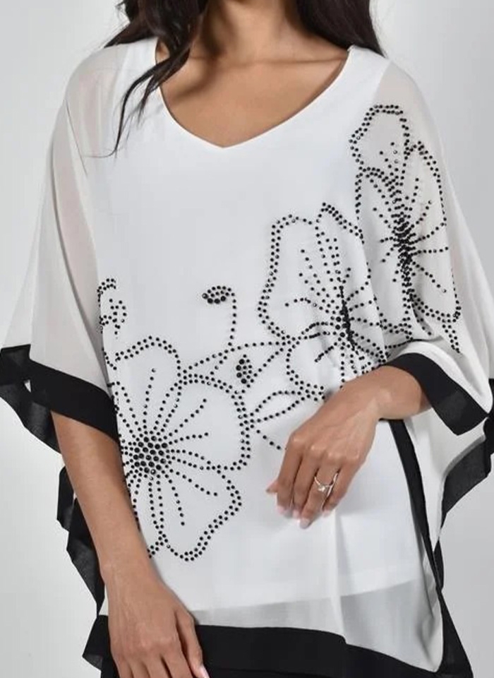 Frank Lyman, Biała tunika zakończona czarną tamą