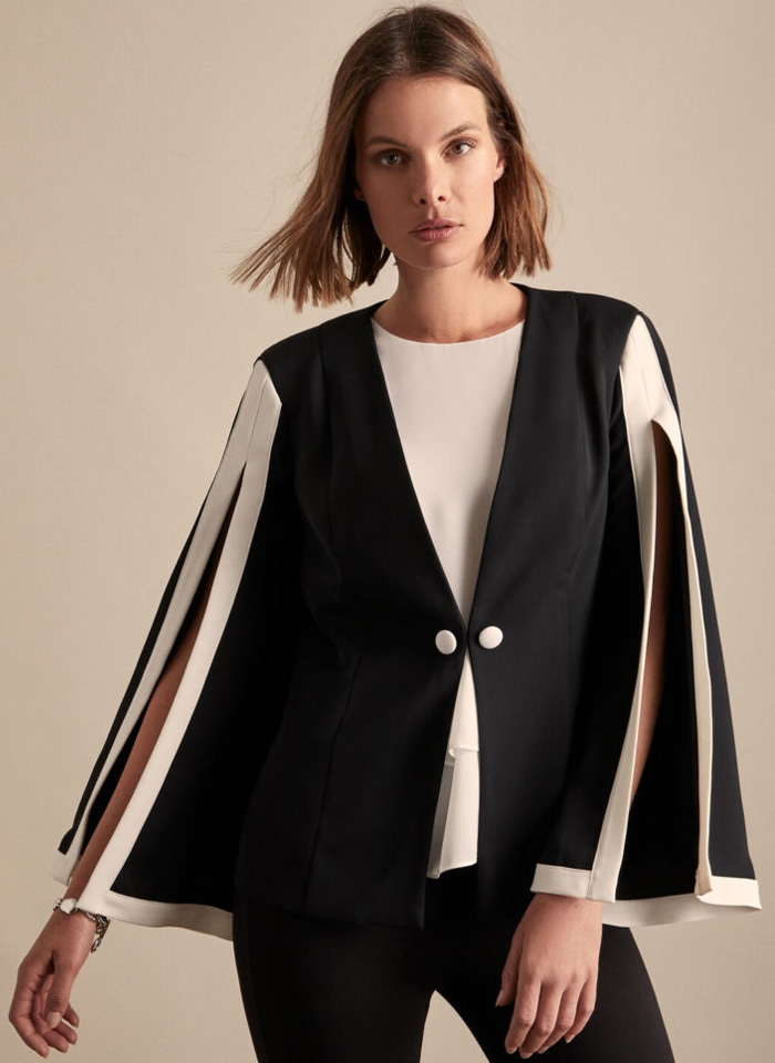 Frank Lyman, Czarny garnitur z lamówką w pudrowym różu.